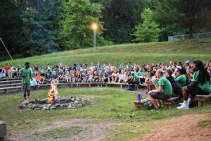 youth around a campfire event