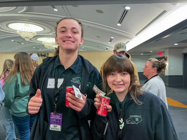 youth with cheerwine cans